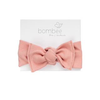 headwrap headband made out of the softest fabric, tie on top to adjust your baby's head. Perfect bow!