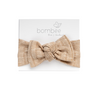 headwrap headband made out of the softest fabric, tie on top to adjust your baby's head. Perfect bow!