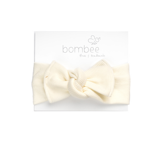 headwrap headband made out of the softest fabric, tie on top to adjust your baby's head. Perfect bow!